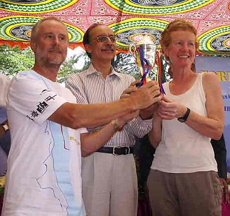 Mr and Mrs Chandler collect a trophy during a stop-off at the Indian island of Goa