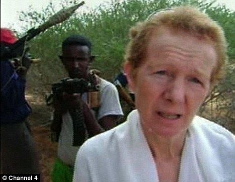 Hostage: Rachel Chandler and her Somali captors. The British couple have previously made a direct plea on video warning UK authorities they fear the 'kidnappers are losing patience' and may kill them